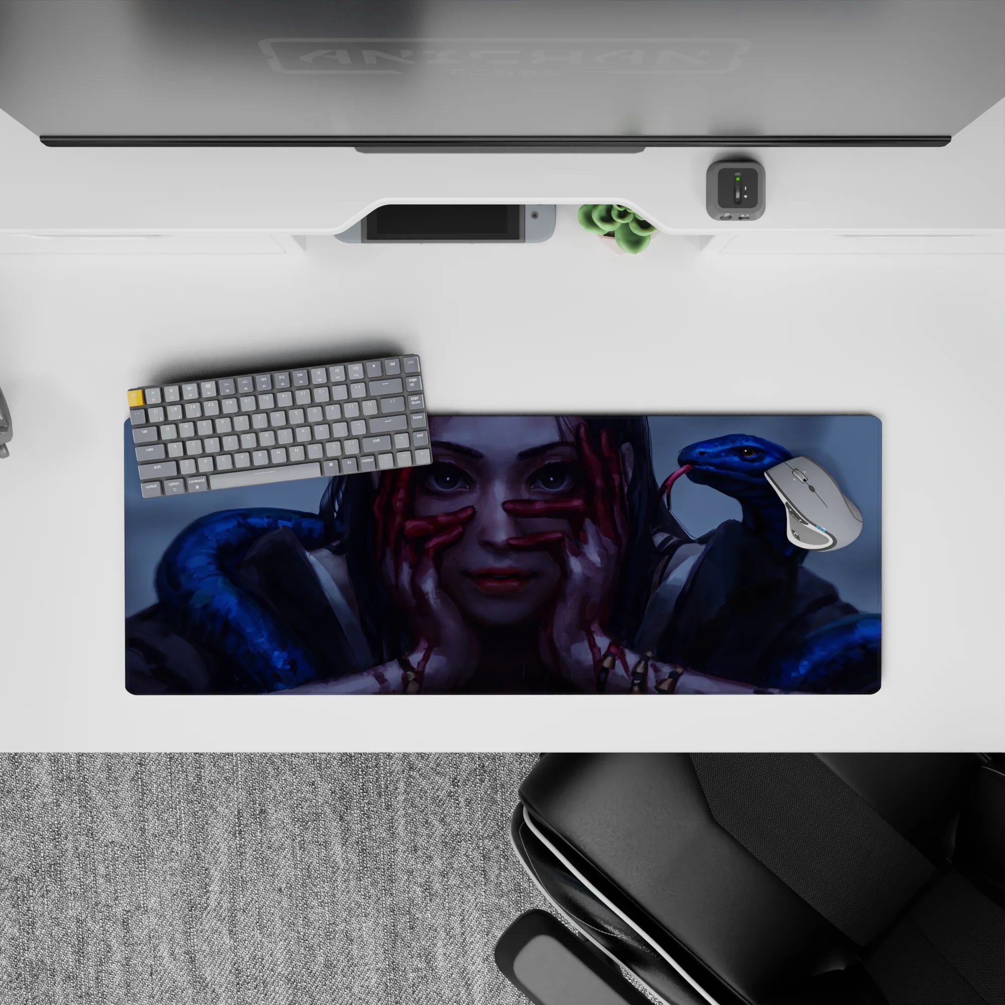 Moody gray-blue lighting anime girl mouse pad 32x12 inches with crimson hands and glossy blue snakes.
