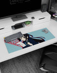 32x12 inches K-ON! Azusa Nakano mouse pad holding paper and pencil mid-cram, soft blush expression.