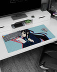 32x16 inches K-ON! Azusa Nakano mouse pad holding paper and pencil, blushing mid-cram on your desk.