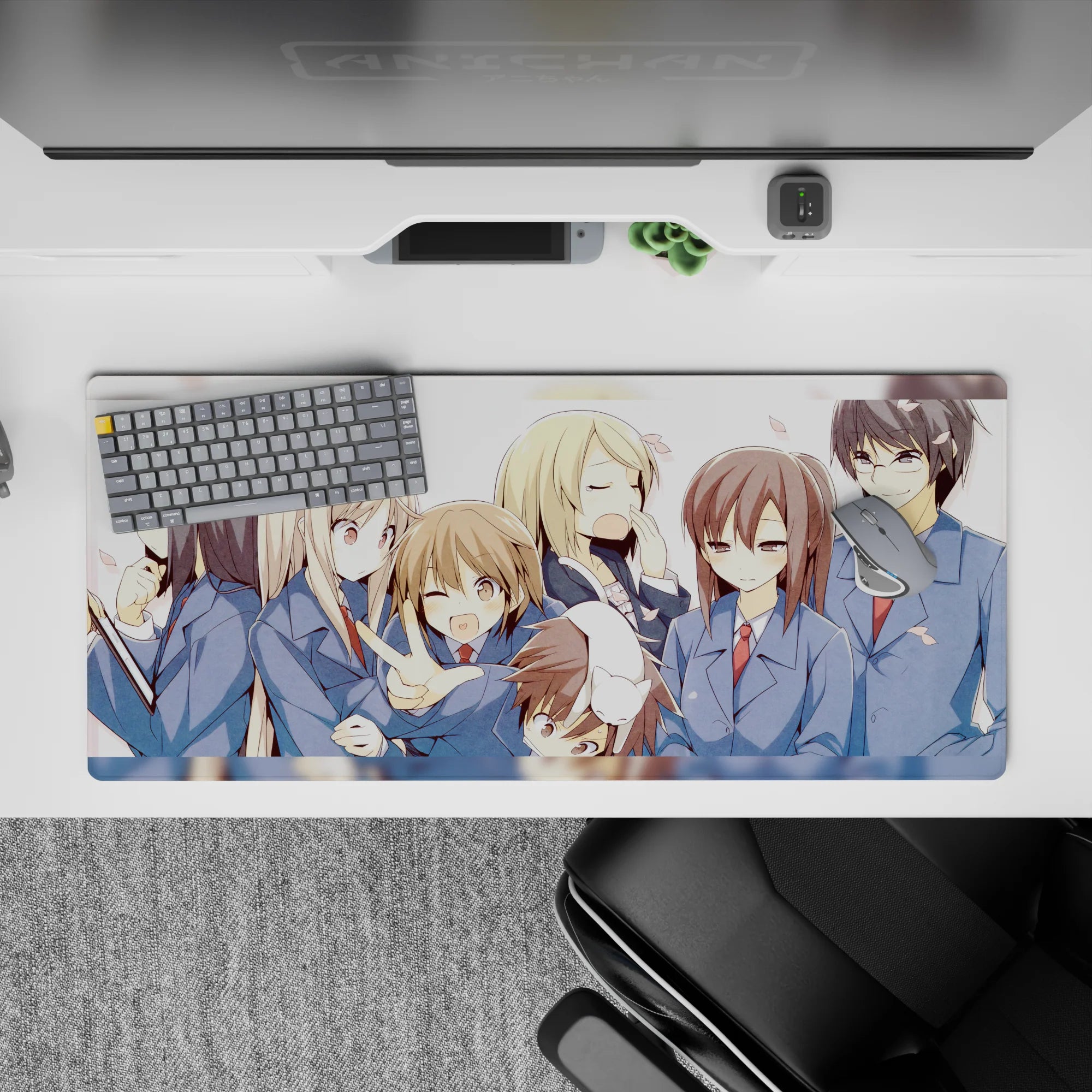 Playful pastel anime desk pad 36x16 inches in soft blues and white space with drifting pink petals.