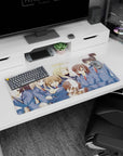 32x16 inches anime girl mouse pad showing uniformed girls crowded together, one winks with a peace sign.