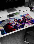 Seras Victoria and Integra Hellsing stare down the night on an anime desk pad 40x20 inches.
