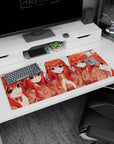 36x16 inches anime girl desk pad showing five cute redheads in a cozy selfie pose, shy to surprised faces.
