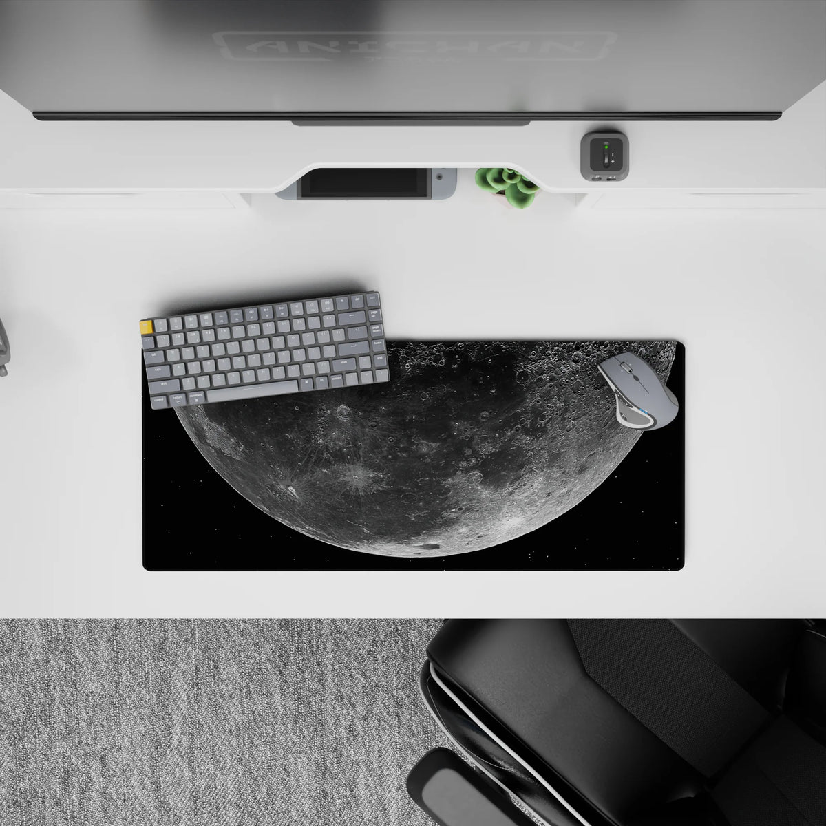 Deep black space mouse pad 28x12 inches with dusty gray craters and soft silver glow, calm night vibe.