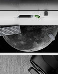 Deep black and dusty gray desk pad 36x16 inches with soft silvery glow and calm night-sky mood.