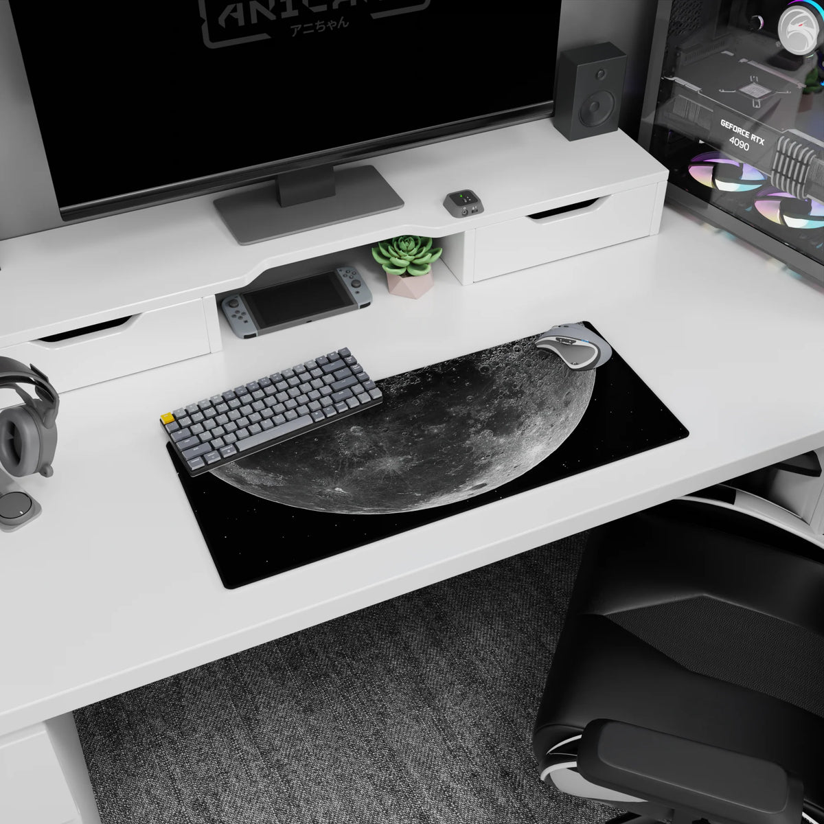 Giant cratered moon over speckled starfield mouse pad, 28x12 inches, smooth extended desk mat.