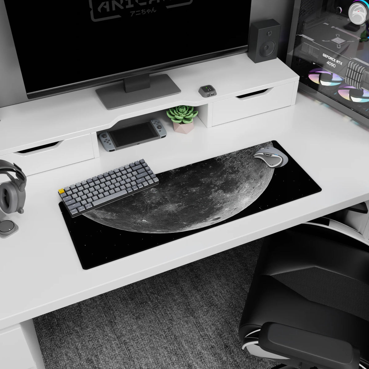 Giant cratered moon drifting above speckled stars 32x12 inches extended mouse pad for desk setup.