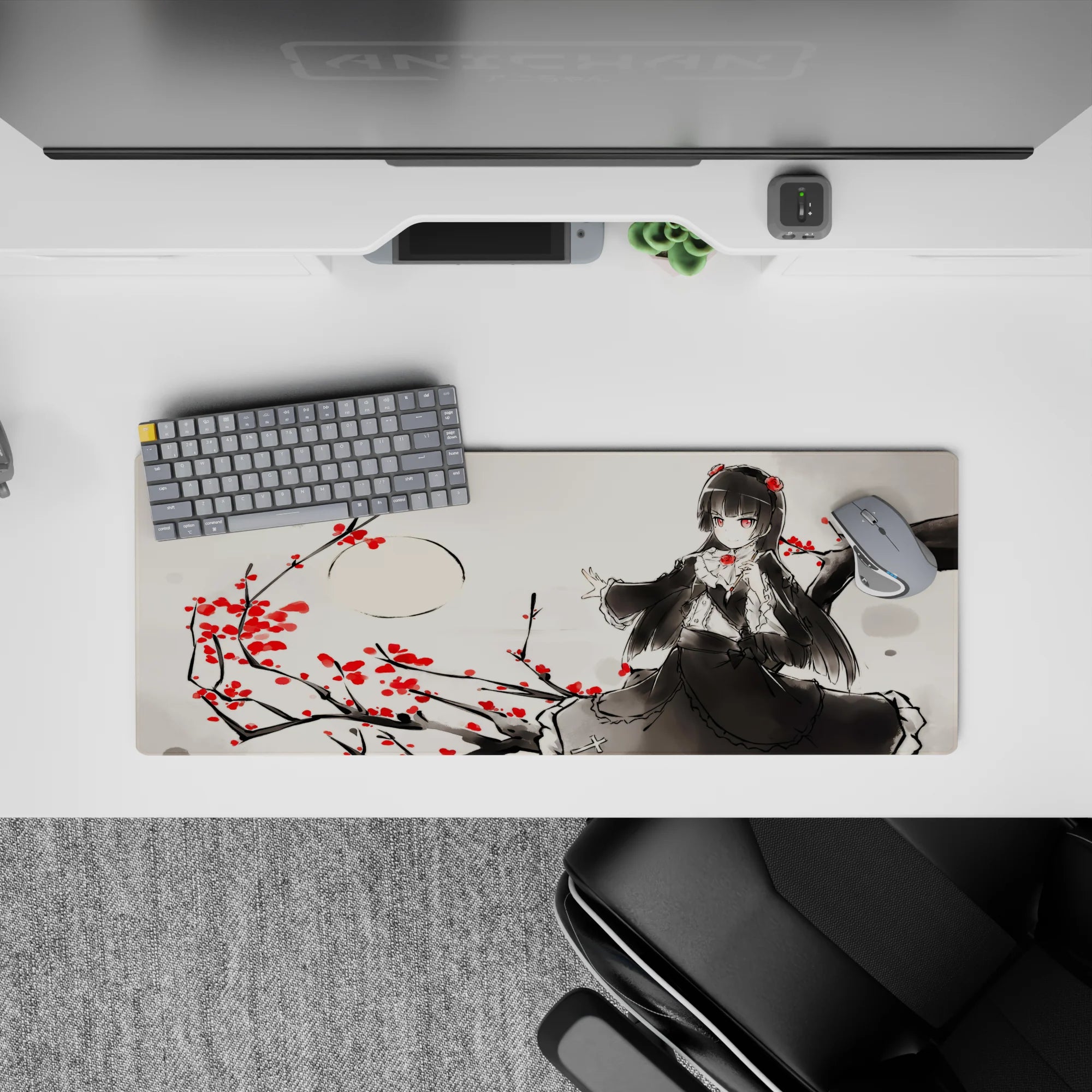 Moody ink-wash gray anime desk mat 32x12 inches with crimson blossoms and red-eyed gothic vibe.