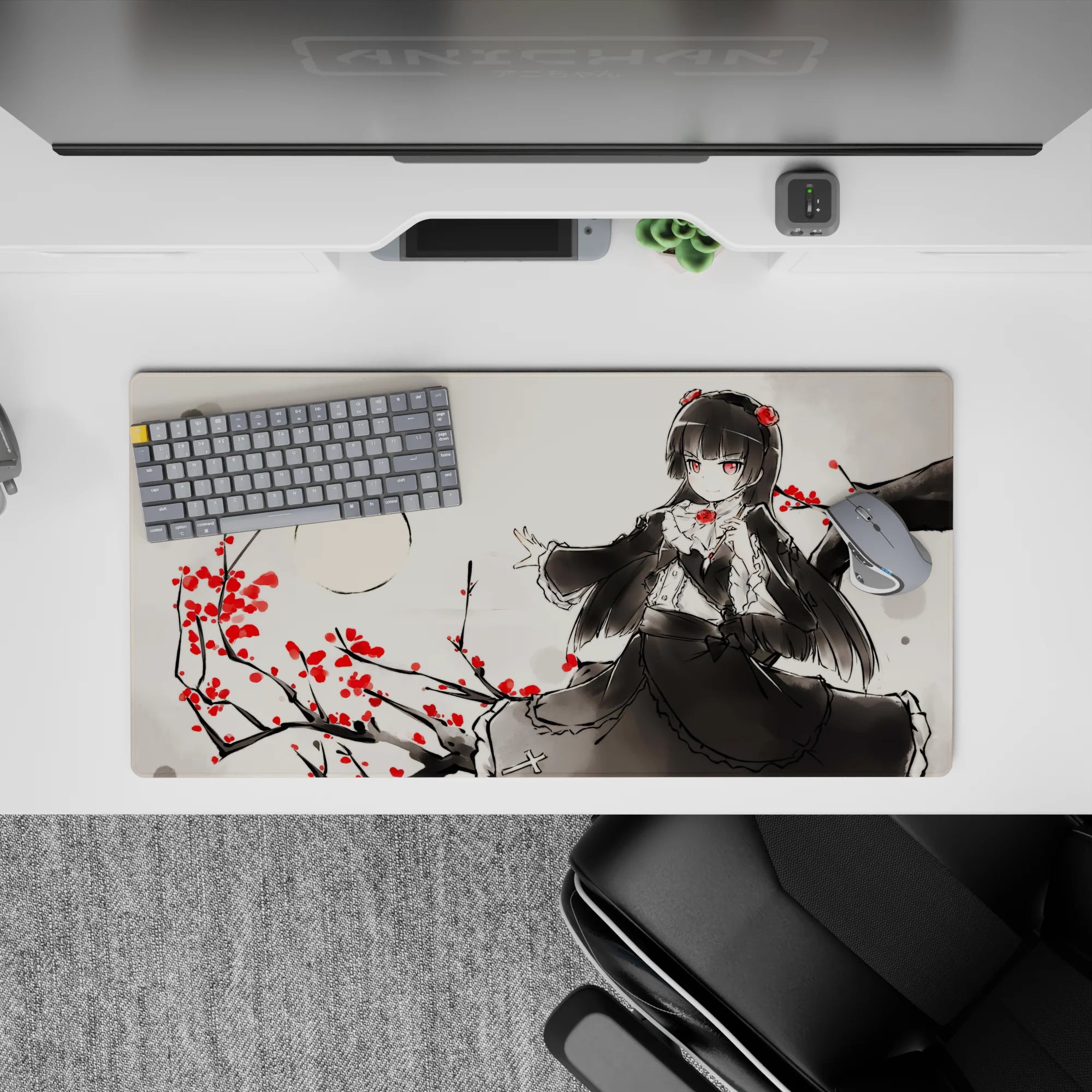 Moody ink-wash gray anime desk mat 32x16 inches with raven-haired girl and crimson blossoms.