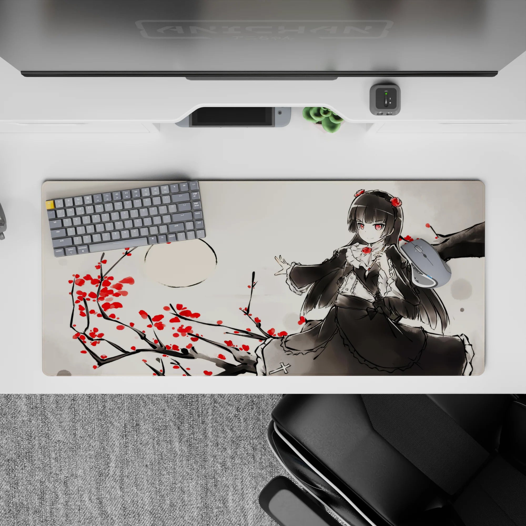 Moody ink-wash gray anime desk pad 36x16 inches with crimson blossoms and sharp red-eyed gothic vibe.