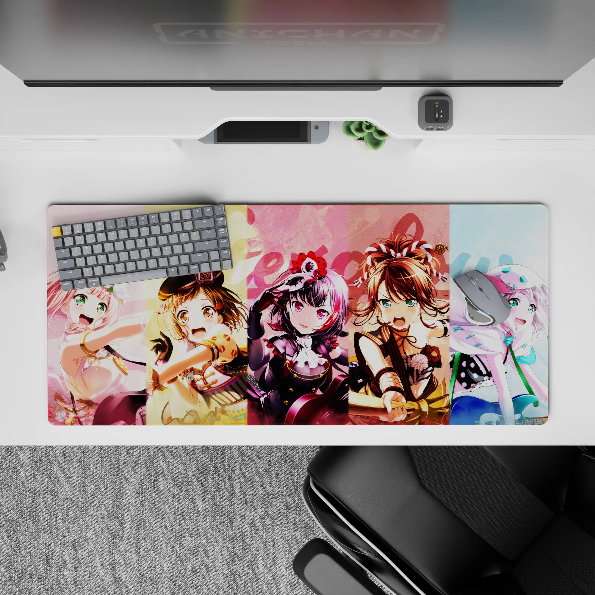 Pastel yellow-pink-blue anime girl desk pad 36x16 inches, bright loud playful stage vibe.