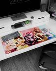 Kasumi Toyama and friends charging in on anime girl desk pad 36x16 inches with sparkly accents.