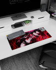 28x12 inches desk mat featuring a raven-haired anime heroine amid swirling red sparks, moody gothic vibe.