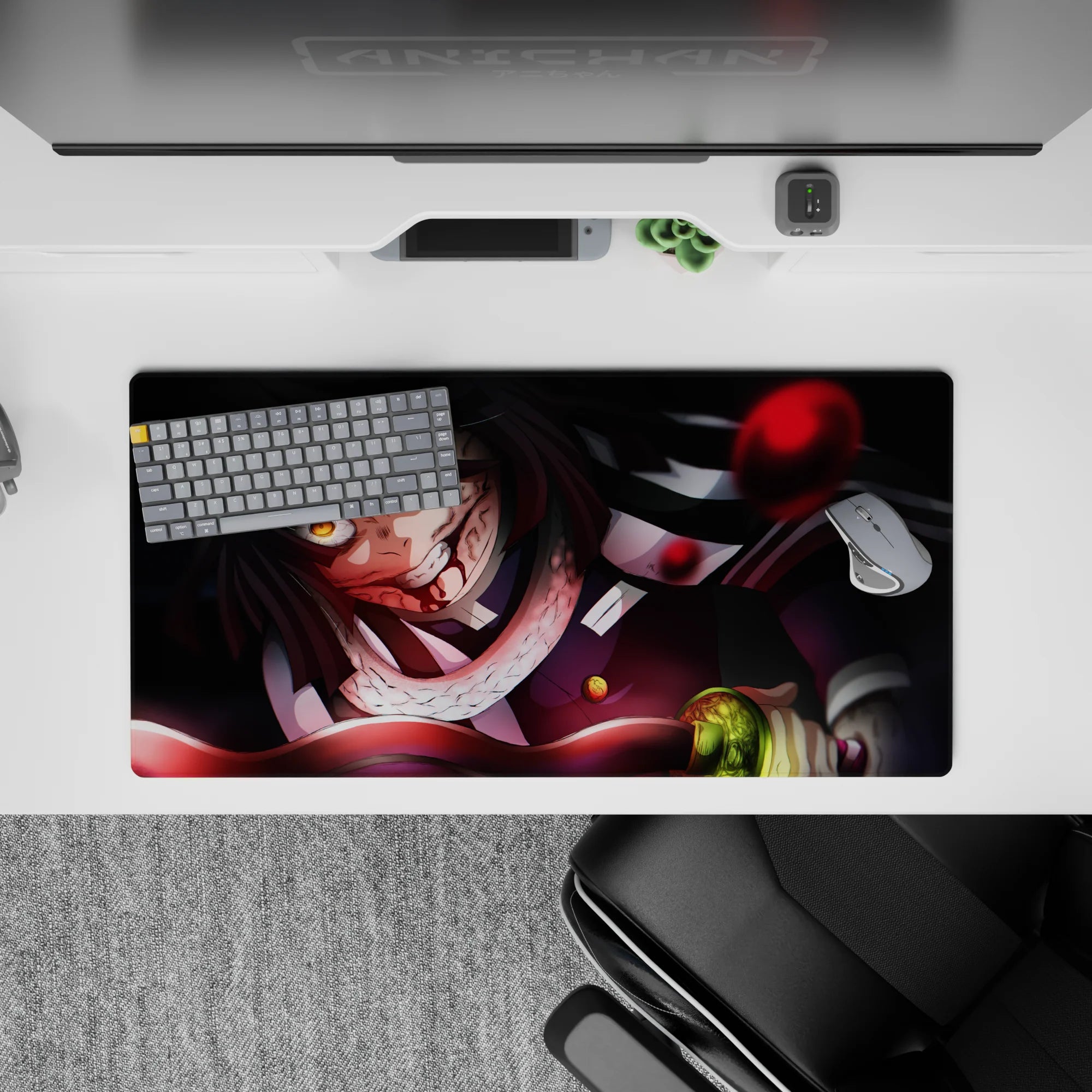 Anime mouse pad 32x16 inches featuring Obanai Iguro mid-battle with serpent; intense black and crimson hues.