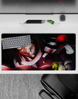 Anime mouse pad 32x16 inches featuring Obanai Iguro mid-battle with serpent; intense black and crimson hues.