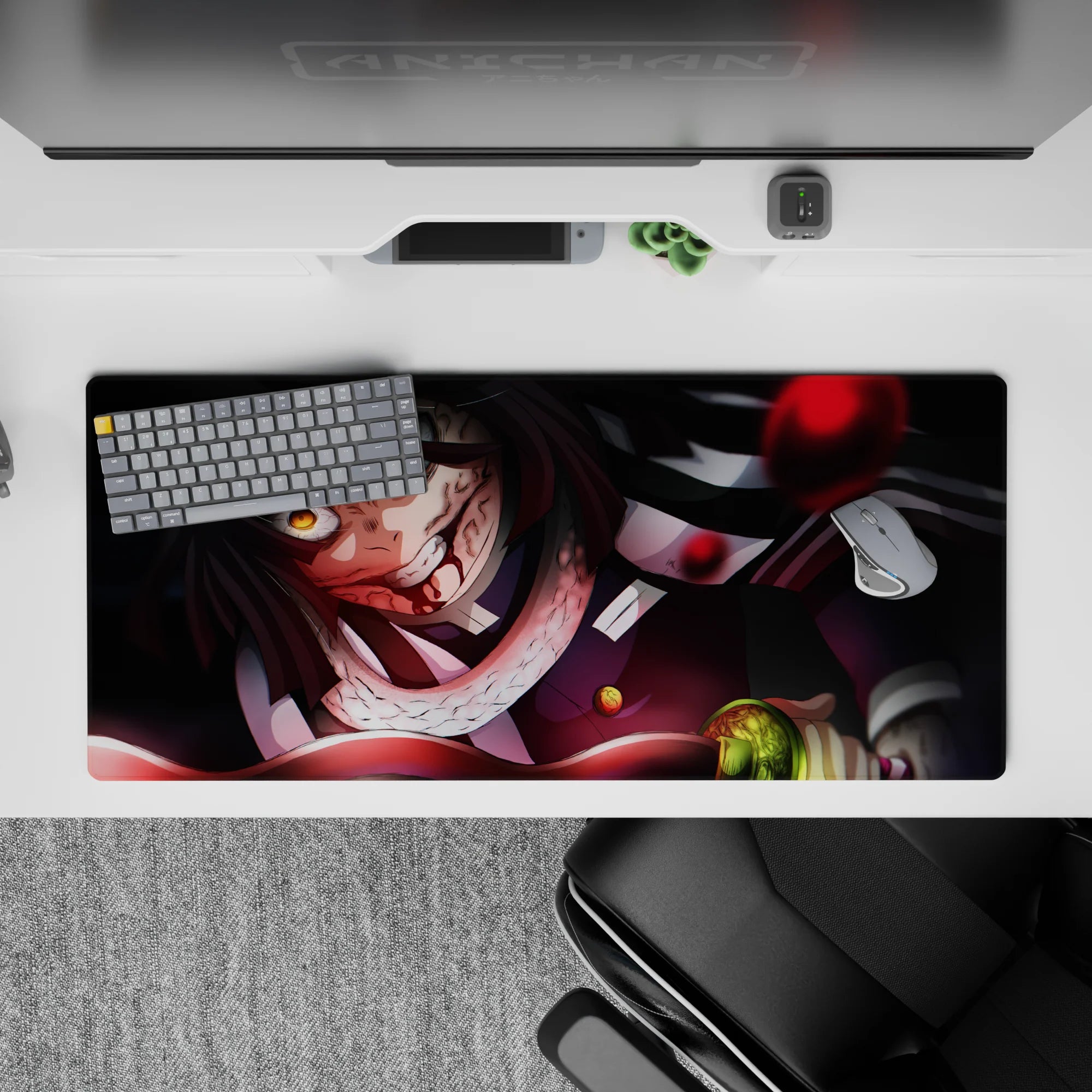 Anime desk pad 36x16 inches featuring Obanai Iguro in battle, serpent coiled, with a black and crimson color palette.