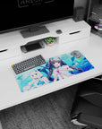 28x12 inches anime mouse pad showing twin catgirls cuddling plush whales over a clean watery background.