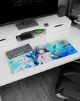Anime girl mouse pad 32x12 inches showing two catgirls with glossy eyes hugging plush whales on a watery backdrop.