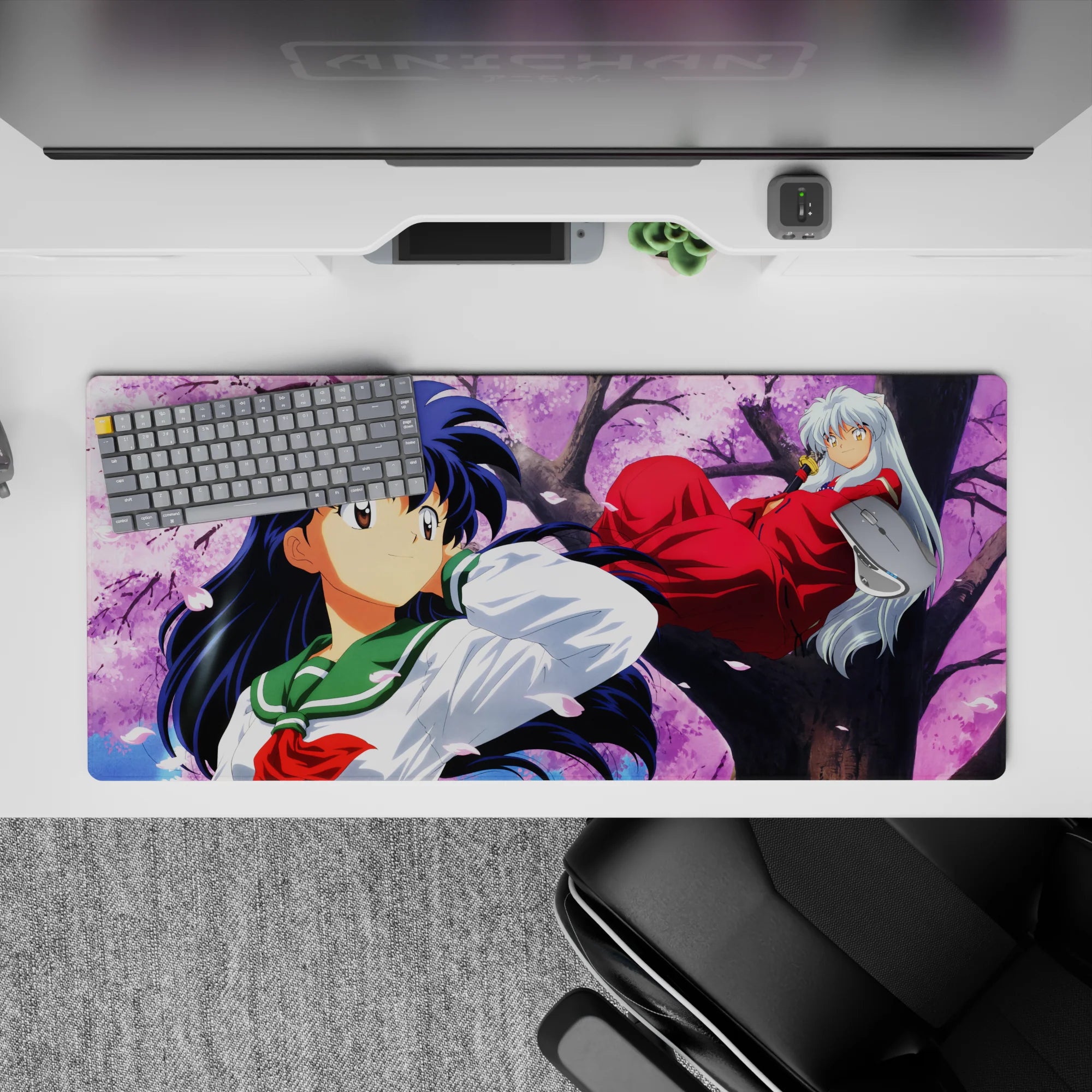 Pink sky and drifting petals anime desk pad 36x16 inches, calm romance vibe with red and green tones.