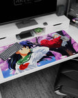 Kagome in green sailor uniform with Inuyasha on a sakura branch anime desk pad 40x20 inches.
