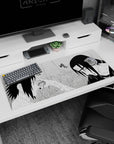36x16 inches Naruto desk pad showing Sasuke Uchiha facing Itachi in a tense rain-sliced manga moment.