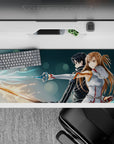 Anime mouse pad 36x16 inches featuring Kirito and Asuna from Sword Art Online, showcasing their glowing swords and powerful poses.