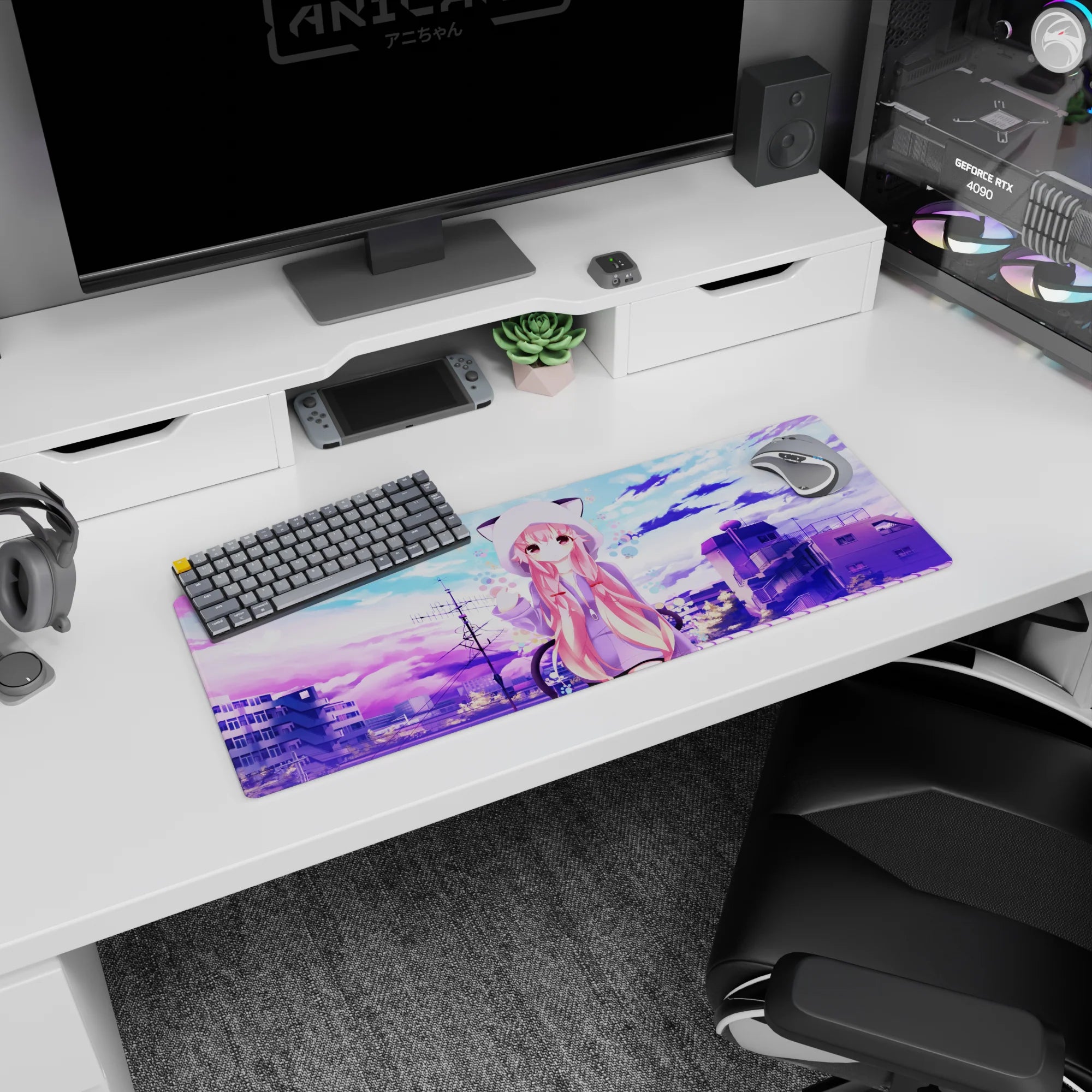 32x12 inches desk mat featuring shy pink-haired anime girl in cat-ear hoodie waving over city rooftops.