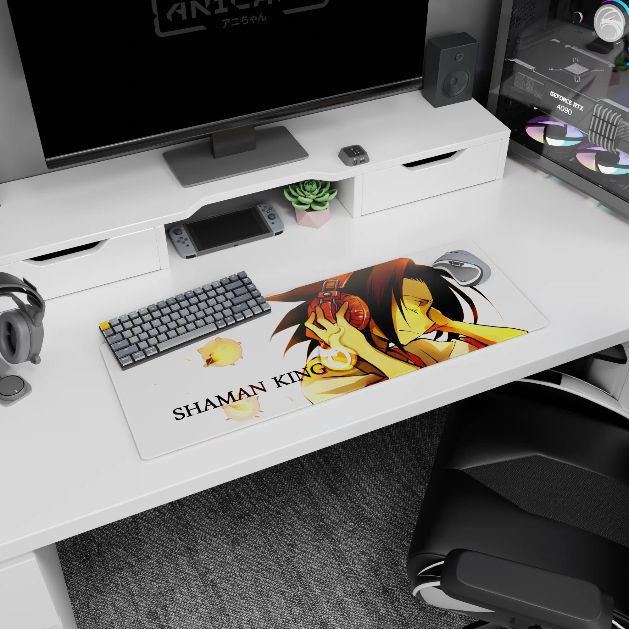 Yoh Asakura leaning in with red headphones, eyes closed, on an anime mouse pad 32x12 inches with spirits.