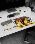 Yoh Asakura eyes closed with red headphones on 36x16 inches anime desk pad, spirits floating nearby.