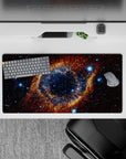 Midnight blue and warm amber nebula desk mouse pad with bright stars, 32x16 inches.