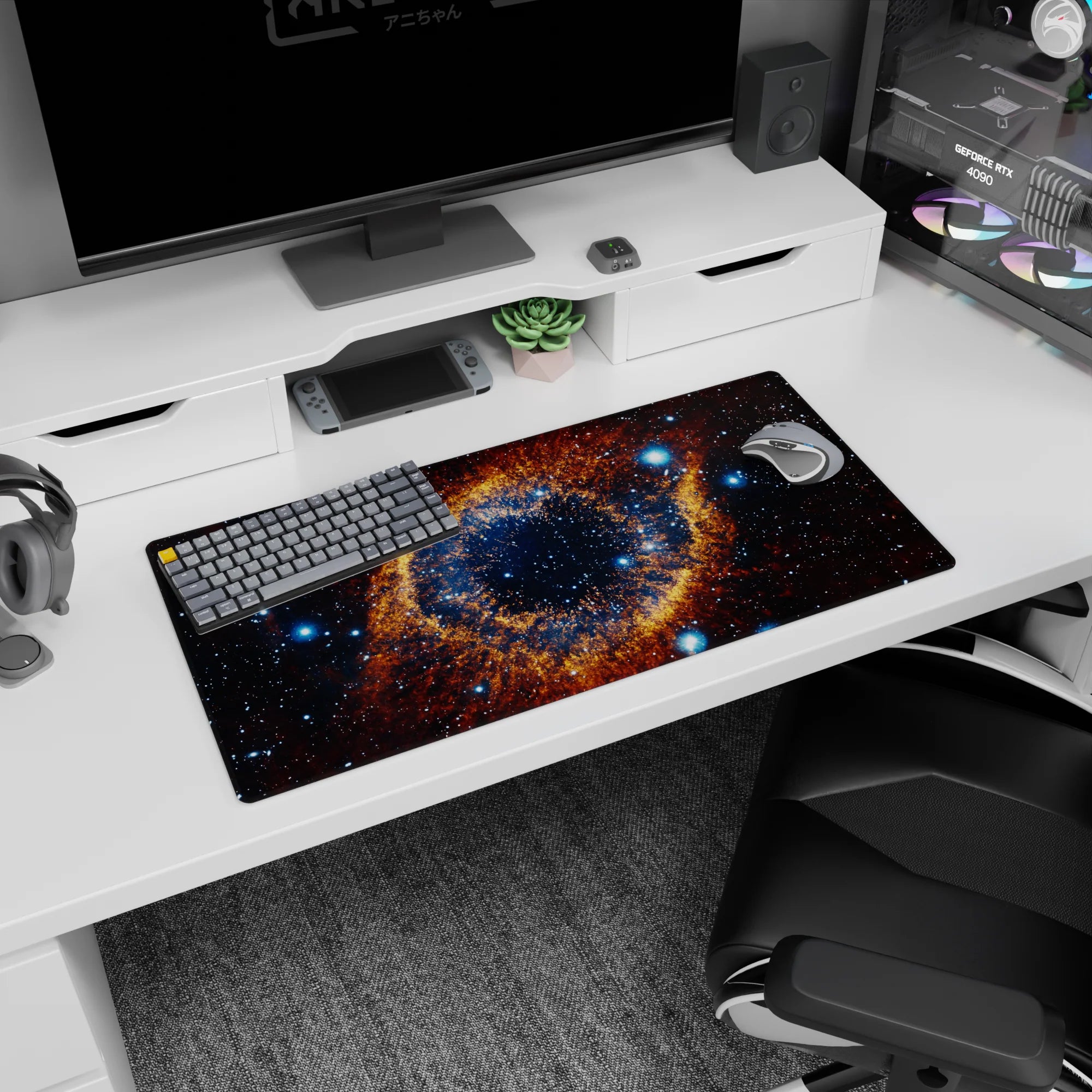 Large cosmic eye nebula pattern mouse pad with inky galaxy backdrop, 32x16 inches.