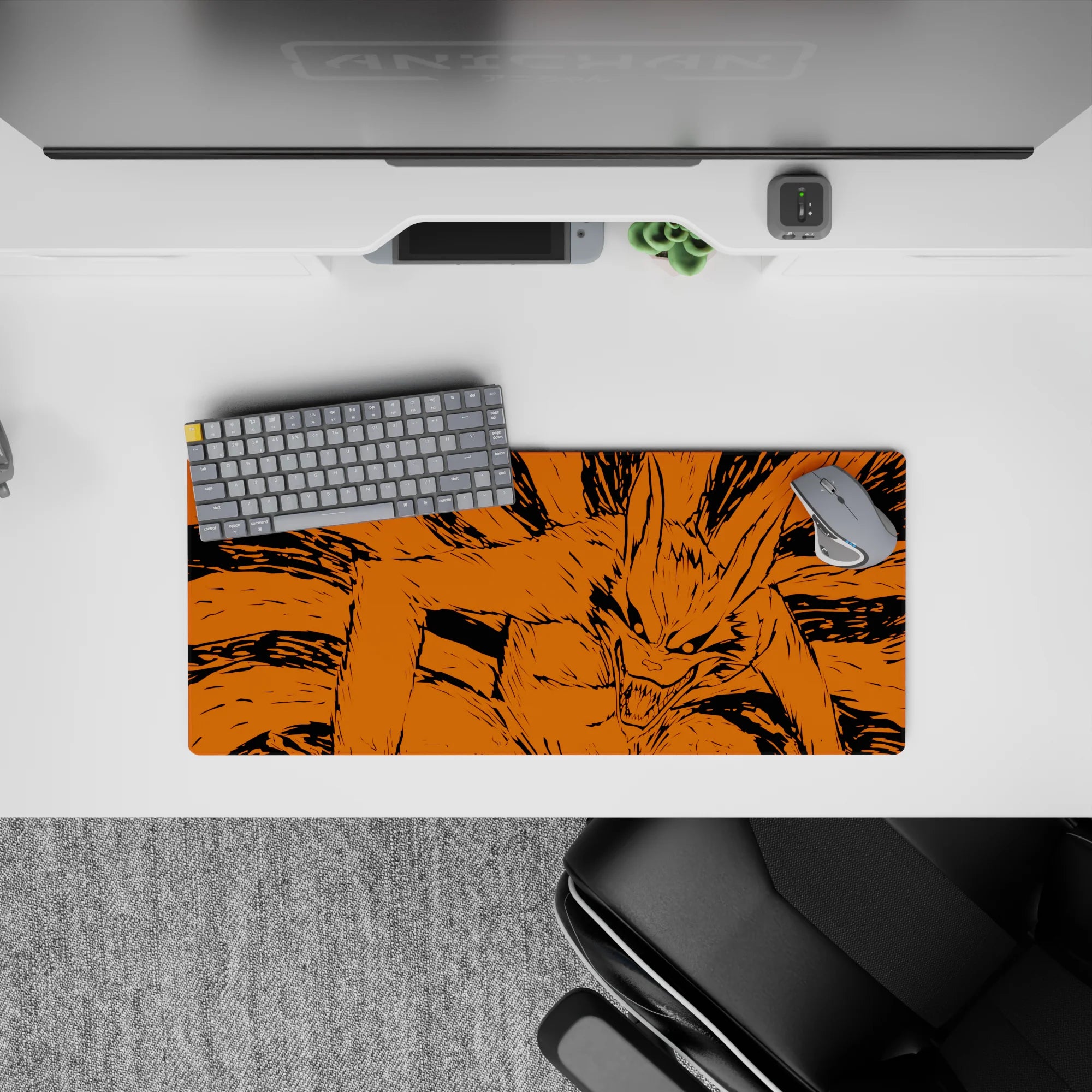28x12 inches anime mouse pad in fierce orange and inky black, wild grin energy for late-night gaming.
