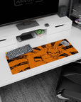 32x12 inches desk mat showing Kurama the Nine-Tails snarling with wild grin, razor strokes on orange.