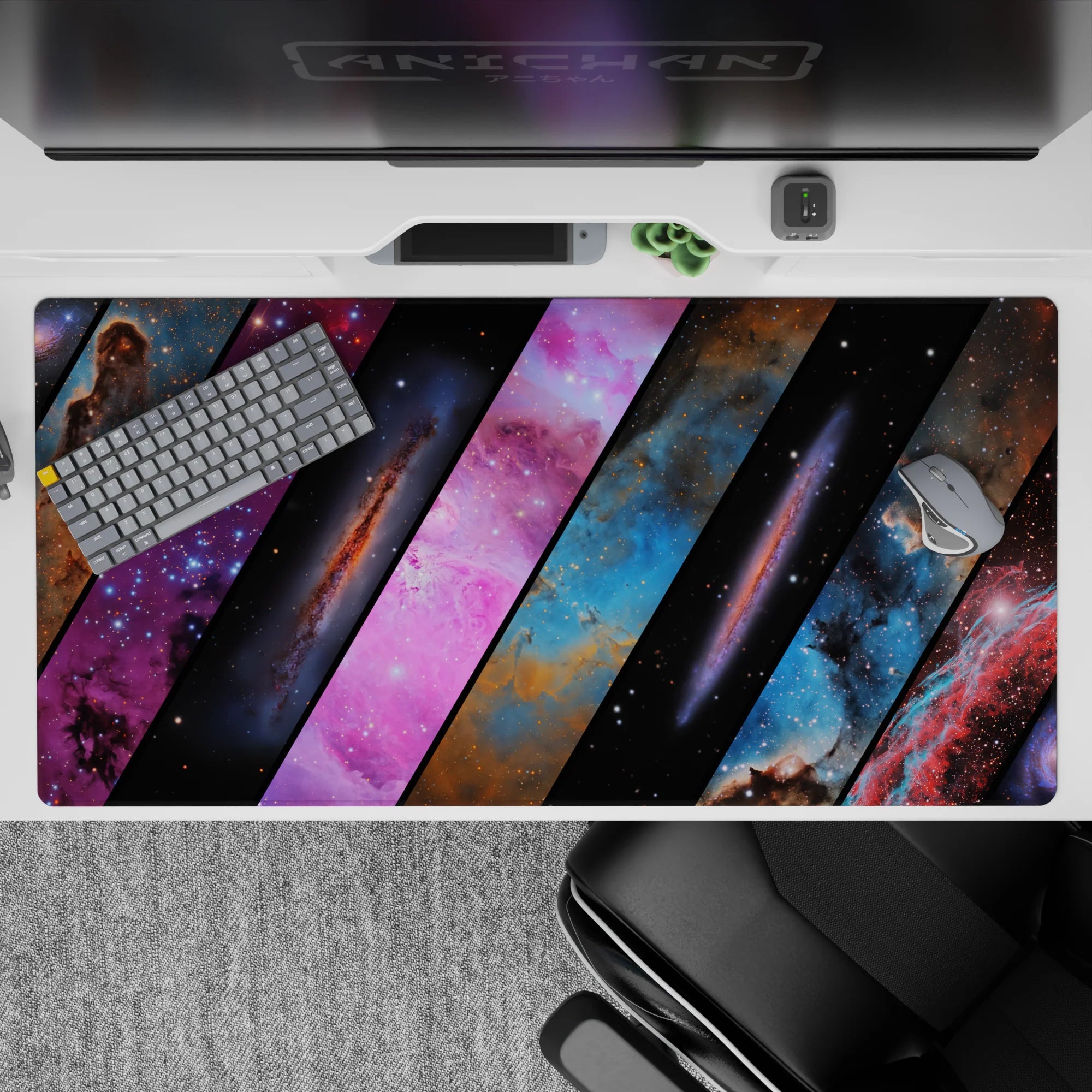 Cosmic gradient desk pad 40x20 inches in purple, electric blue, pink, and smoky black tones.