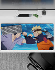 32x16 inches anime mouse pad in blue splash tones with bold orange, black, and lavender highlights.