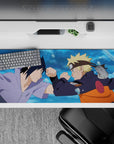 36x16 inches anime desk pad in blue water-splash tones with orange, black, and cool lavender accents.