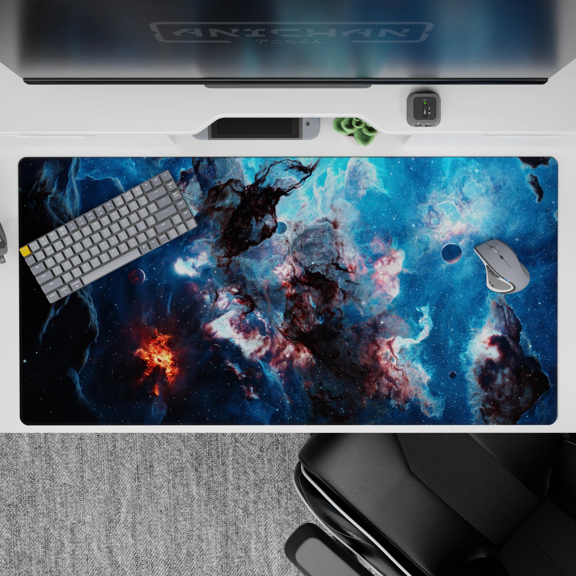 Ocean-blue and charcoal galaxy desk pad with ember-orange flare, 40x20 inches.