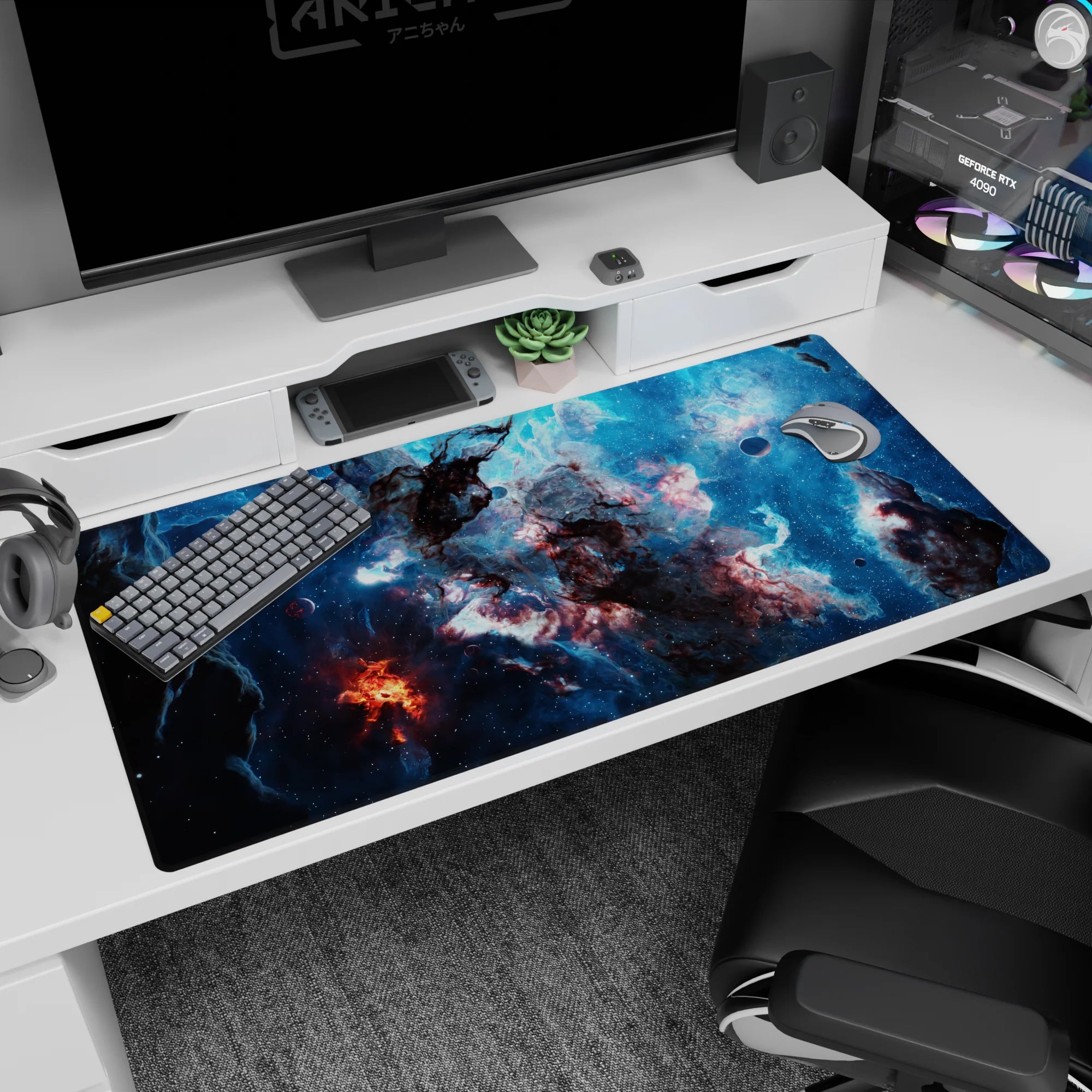 Deep-space scene desk pad of swirling nebula clouds and small planets, 40x20 inches.
