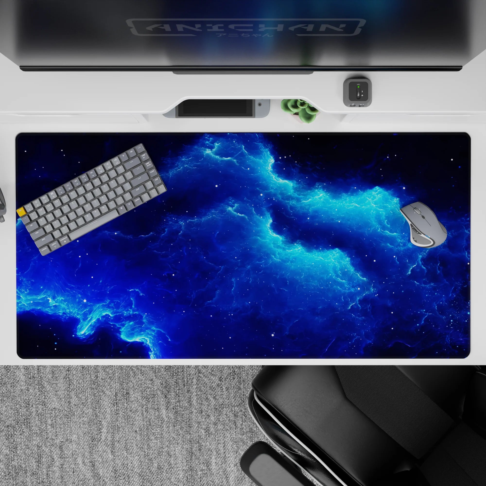 Moody deep-space desk pad 40x20 inches in midnight navy with calming electric blue glow.