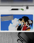 Peaceful anime mouse pad 32x16 inches in cool blues with warm browns, red robe accents, calm intimate mood.