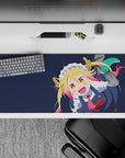 36x16 inches anime desk pad in deep navy with bright blonde hair, pink tips, crisp frills, playful vibe.