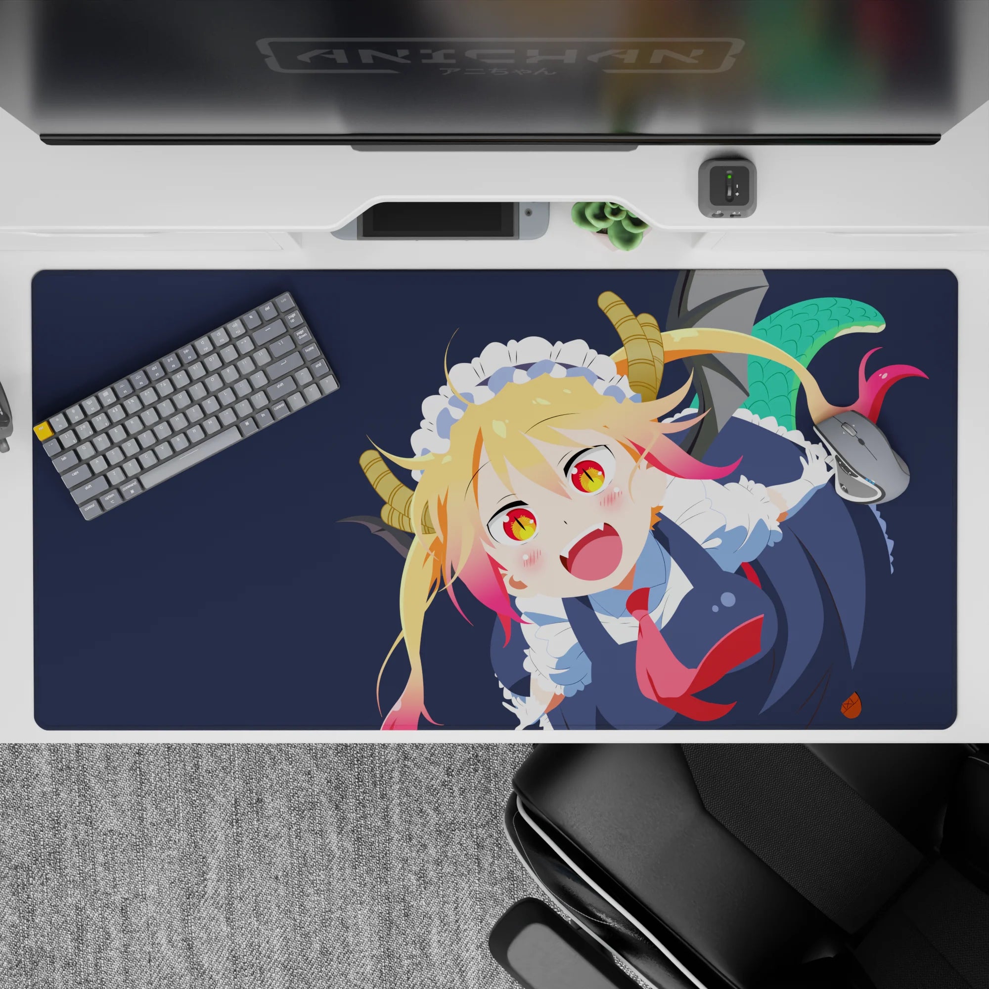 40x20 inches desk pad in deep navy with blonde hair and pink tips, playful chaos grin, red tie pop.