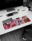 32x12 inches anime mouse pad showing a grinning chaotic girl beside a cool silver-haired teammate, facing forward.