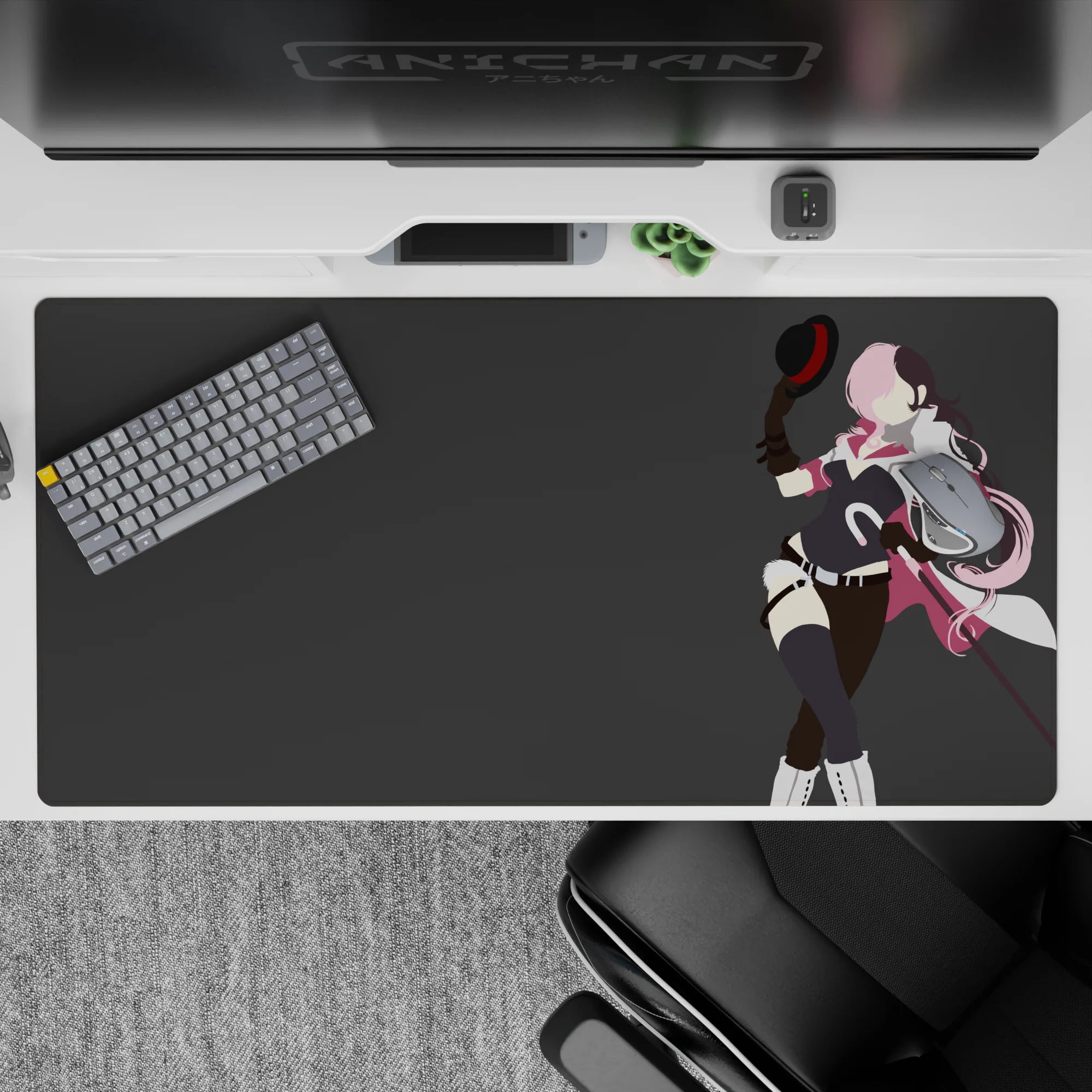 Flirty pink-and-black anime desk pad 40x20 inches, bold minimal lines on a flat gray backdrop.