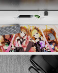 Anime girl desk pad 36x16 inches in warm peach lights, candy pink, and soft gold glow for a cute stage mood.