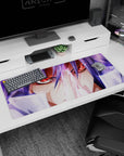 Red-eyed anime warrior with windblown violet hair on desk pad 36x16 inches, locked-in stare scene.