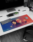 Cute anime desk pad 36x16 inches showing twin-bun schoolgirls, glossy eyes, blush, dango snack scene.