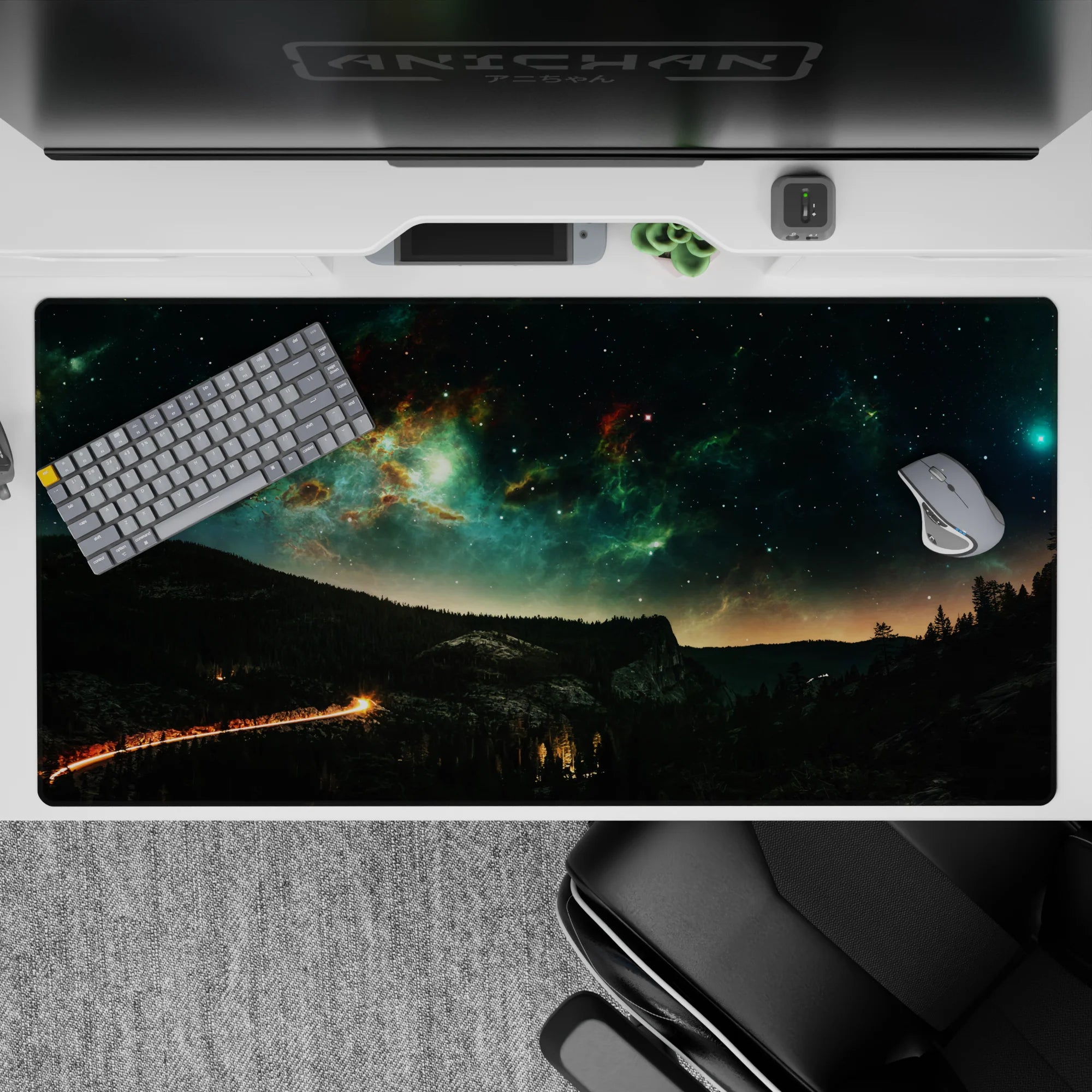 Moody teal greens and inky black space textures desk pad, 40x20 inches.