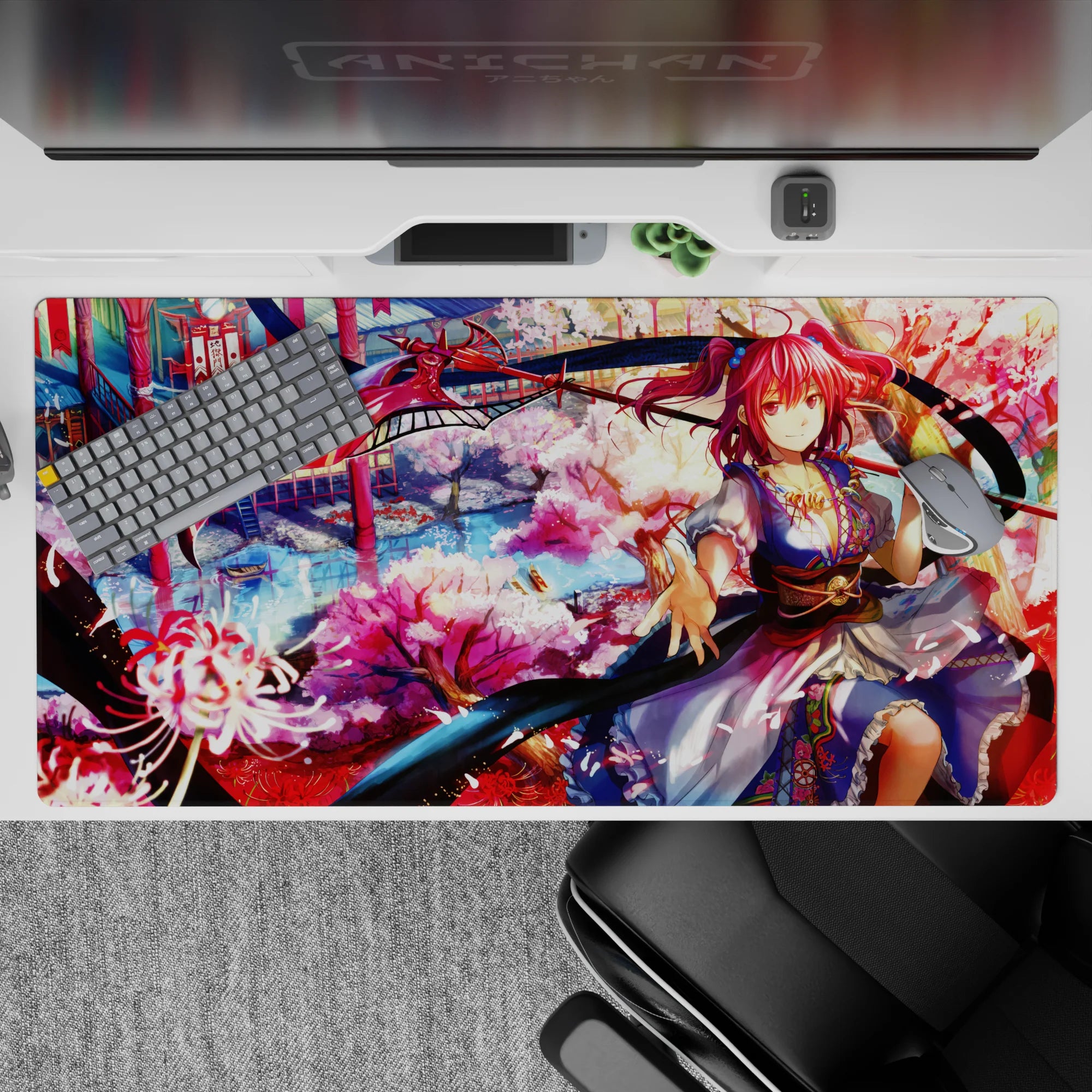Dreamy 40x20 inches anime desk pad in lantern red, sakura pink, and river blue with drifting petals.