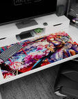 Pink-haired shrine warrior with scythe ribbon under cherry blossoms on 40x20 inches anime girl desk pad.